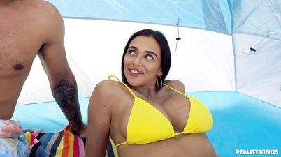 Dark-haired beauty in a yellow bikini takes good care of BBC