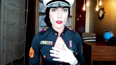 Seductive Marine babe in uniform shows her big fake tits topless
