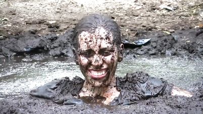 Busty Samantha gets very dirty outdoors in pool of mud